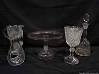 Group shot of all four clear glass pieces