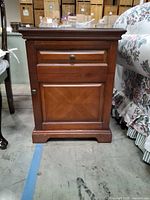 Front view of closed wooden cabinet