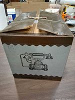 Closed cardboard box with printed phone illustration and Intercontinental Phone Co. branding