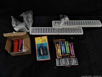 Overview of all items: 2 LED bars, boxed flashlights, EverBrite pack, hole saw
