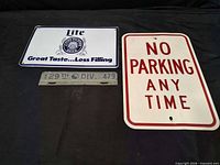 Front of Miller Lite sign, No Parking sign, and 29th Division tag