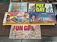 All five boxed games laid out on table