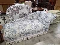 Full view of chaise lounge showing pattern and fringe