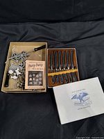 Overview of molds set with handle and Party-Patty leaflet, and boxed knives