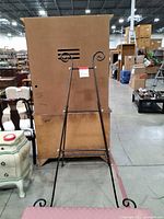 Front view of metal easel standing upright