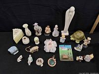 Group shot of all figurines and items on black background