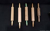 Five rolling pins laid out showing overall variety