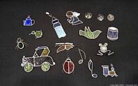 Full assortment of stained glass ornaments on black background
