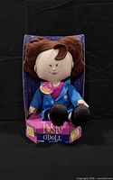 Front view of Rosie O'Doll in packaging
