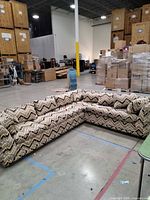 Full view of L-shaped sectional in warehouse