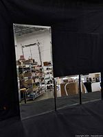 All three unframed mirrors standing together for scale