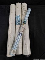 Group shot of all five sealed rolls showing patterns and packaging