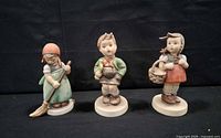 All three Hummel figurines grouped