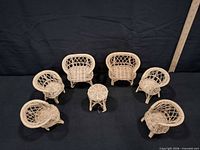 Full set of seven wicker dollhouse pieces displayed