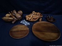assortment of wooden bowls, fruit, discs, hardware layout
