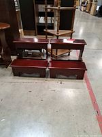 Four wooden two-step stools visible, lot includes the front matching pair