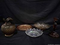 group view of all five amber and carnival glass items