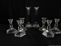 Group shot showing all eight crystal candlestick holders in size order