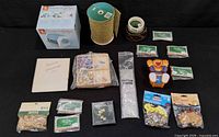 All items arranged on black backdrop showing full lot contents