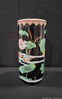Full frontal view of cylindrical porcelain vase showing lotus and bird design
