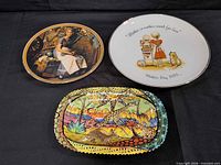Three decorative plates grouped together