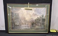 Front view of framed print with picture light