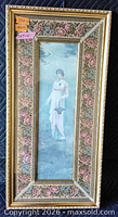 front view showing blue portrait print, floral mat and gilded frame