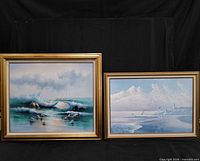 Two framed seascape artworks side by side