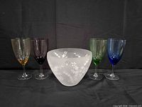 Group shot of Lenox bowl centered with four coloured wine glasses