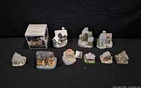 Group shot of all ten resin village buildings plus boxed church
