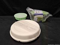 Lettuce keeper boxed, interior basket with lid, and wrapped divided tray overview