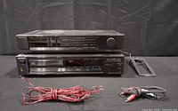 Sony tuner stacked on Sony CD player with accessory cables in front