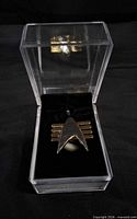 Badge inside clear plastic display box