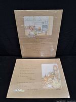 Two shrink-wrapped teddy bear poem prints displayed front