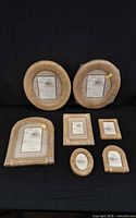 All seven rattan Tiffany photo frames grouped