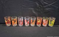 Full set of eight character glasses lined up
