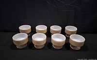 Front view of eight identical Federal Glass dessert cups in a row