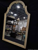 Front view showing arched mirror and frame style