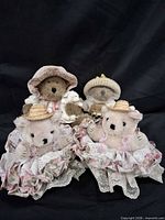 Group shot of four teddy bears and accessories