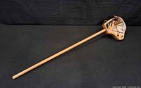 Full view of wooden hobby horse showing entire length and head detail