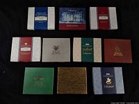 Ten boxed ornaments laid out for count and sleeve colors
