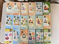 All 18 cartridge cases laid out in three rows showing front artwork and titles