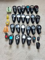 Full set of 30 paper punches laid out on carpet