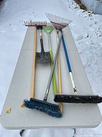 All six yard tools laid out on table for overview