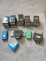 Group shot of thirteen paper punches displaying fronts and shape icons