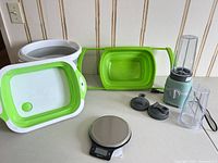 Full lot view showing bucket, colander, scale, blender, extra cup and lids