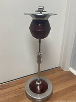 Full view of standing ashtray showing pedestal and materials