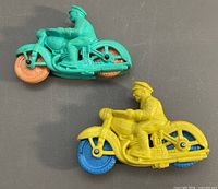 Turquoise and yellow rubber motorcycles top-down view