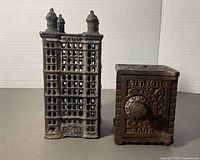 Front view of both cast iron banks side by side