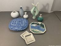 Group shot showing all ceramic plates, vases and Tinn dishes